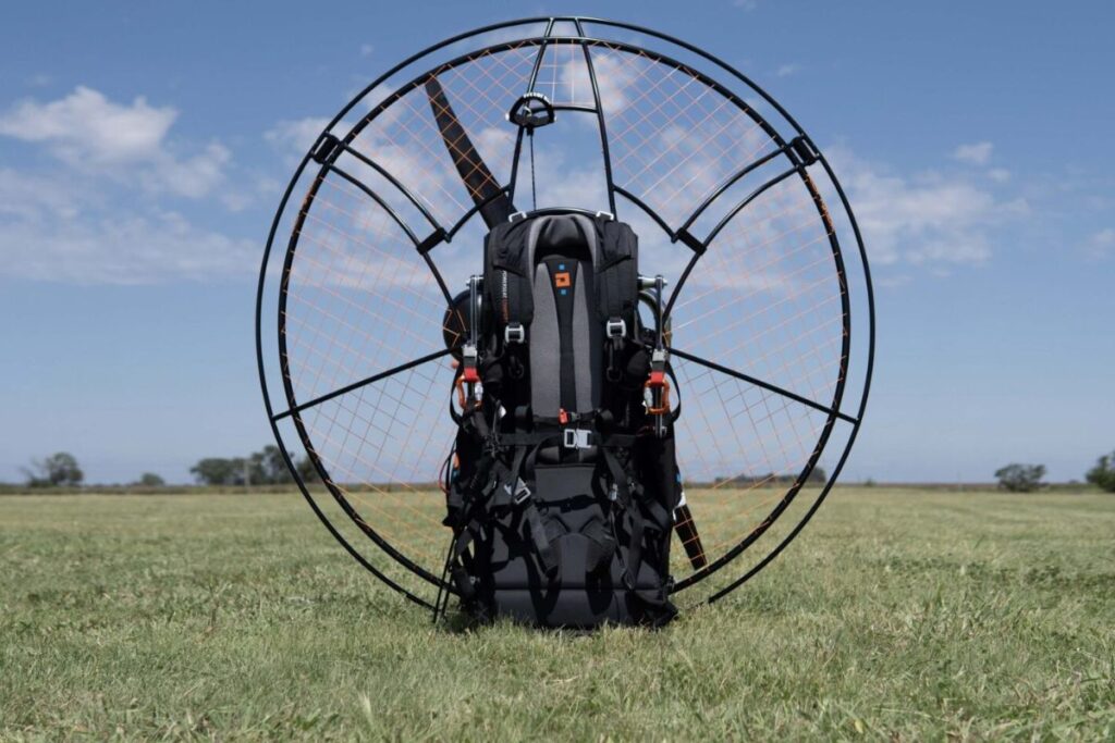 Kangook Amaruk XD paramotor in natural setting, with 151cm extended diameter cage for enhanced power and efficiency.